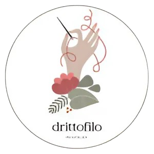 a logo with a hand holding a needle and thread